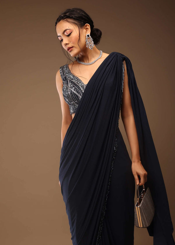 Mood Indigo Pre Drape Saree With A Crop Top In Sequins Embroidery Corset Neckline With A Tie-Up Tassel Dori At The Back