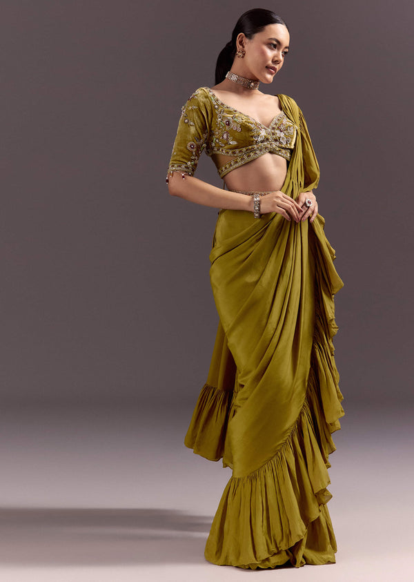 Olive Green Velvet Saree With Frilled Pallu And Heavy Embroidered Blouse