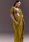 Olive Green Velvet Saree With Frilled Pallu And Heavy Embroidered Blouse